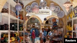 Russian tourists are seen shopping at the old medina in Sousse, Tunisia, Sept. 30, 2017.