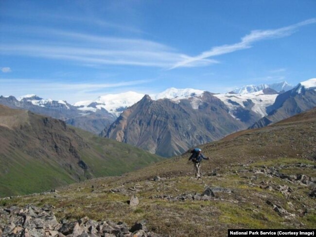 A backpacker hikes in the backcountry area of Wrangell-St. Elias National Park