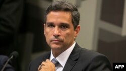 Brazilian senior banking executive Roberto Campos Neto, who is nominated by Brazilian President Jair Bolsonaro for the presidency of Brazil's Central Bank, gestures during a meeting of the Brazilian Federal Senate Economic Affairs Committee (CAE) in Brasilia, Feb. 26, 2019.