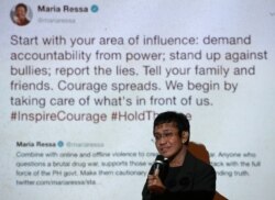 FILE - Maria Ressa speaks at an event attended by law students at the University of the Philippines College of Law in Quezon City, Metro Manila, Philippines, March 12, 2019.