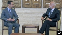 Syria's President Bashar al-Assad (L) meets Jakob Kellenberger, president of the International Committee of the Red Cross [ICRC], in Damascus, Syria, September 5, 2011.