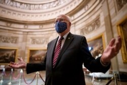 Sen. Patrick Leahy, D-Vt., the new president pro tempore of the Senate, pauses in the Rotunda of the Capitol before the article of impeachment against former President Donald Trump is delivered in Washington, Jan. 25, 2021.