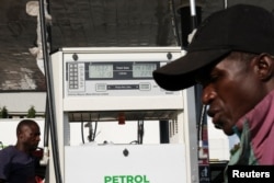 A drivers takes his turn to refuel at the NNPC station in Abuja, Nigeria, on Sept. 2, 2024.