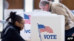 People vote in the Super Tuesday primary at Centerville High School, March 1, 2016, in Centerville, Virginia.