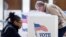 FILE - People vote in the Super Tuesday primary at Centerville High School in Centerville, Virginia, March 1, 2016.