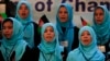 FILE - Girls sing the Afghan national anthem at an event in Kabul, Afghanistan, Sept. 26, 2013.