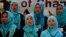 FILE - Girls sing the Afghan national anthem at an event in Kabul, Afghanistan, Sept. 26, 2013.