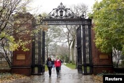 FILE - Students walk on the campus of Yale University in New Haven, Connecticut, Nov. 12, 2015.
