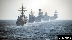 2020年3月15日美利堅遠征打擊群與羅斯福號航母作戰群在南中國海演練。（美國海軍照片）