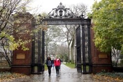 FILE - Students walk on the campus of Yale University in New Haven, Connecticut, Nov. 12, 2015.