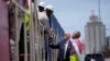 FILE - Presiden Joe Biden dan Kepala Operasional Lobito Atlantic Railway Nicolas Gregoire bertemu dengan para pekerja kereta api selama tur di Terminal Pelabuhan Lobito di Lobito, Angola, 4 Desember 2024. (Ben Curtis/AP)