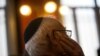 FILE - A man wearing a Jewish yarmulke listens during a news conference at the Royal Spanish Academy in Madrid, Spain, Feb. 20, 2018.