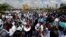 Ouma Oluga, Secretary-General of the Kenya Medical Practitioners, Pharmacists and Dentist Union (KMPDU), addresses doctors during a strike to demand fulfillment of a 2013 agreement between their union and the government, outside Ministry of Health headquarters in Nairobi, Dec. 5, 2016.
