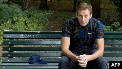 FILE - This photo posted Sept. 23, 2020, on the Instagram account of @navalny shows Russian opposition activist Alexei Navalny sitting on a bench in Berlin as he was recuperating from a poisoning attempt.