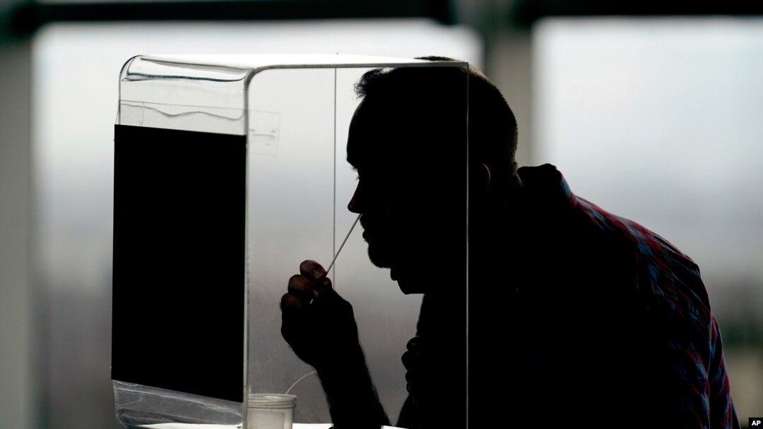 University of Utah student Andrew Goaslind takes a rapid COVID-19 test, Nov. 18, 2020, in Salt Lake City.