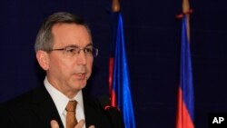 FILE - U.S. Principal Deputy Assistant Secretary of State for East Asian and Pacific Affairs Scot Marciel gestures during a press conference in Phnom Penh, Cambodia, Nov. 4, 2013. 