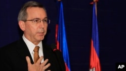 FILE - U.S. Principal Deputy Assistant Secretary of State for East Asian and Pacific Affairs Scot Marciel gestures during a press conference in Phnom Penh, Cambodia, Nov. 4, 2013. 