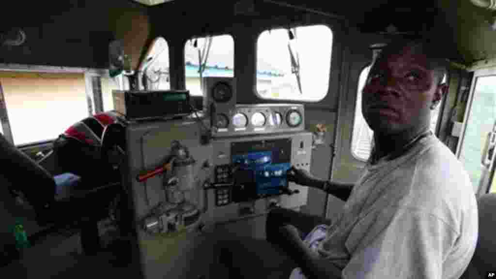 A train driver is seen on an Ooni of Ife train to Kano, in Lagos, Nigeria.