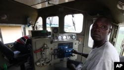 A train driver is seen on an Ooni of Ife train to Kano, in Lagos, Nigeria.