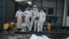 Members of the Congolese Red Cross stand amid bodies in body bags at the morgue of Goma General Hospital on Feb. 1, 2025.