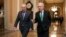 FILE - Senate Republican Majority Leader Mitch McConnell, and Senate Democratic Minority Leader Chuck Schumer left, walk toward the Senate chamber at the U.S. Capitol, in Washington, Feb. 7, 2018.