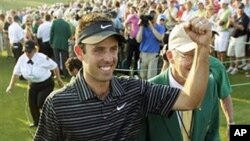 Charl Schwartzel of South Africa celebrates after finishing the final round of the Masters golf tournament Sunday, April 10, 2011, in Augusta, Georgia