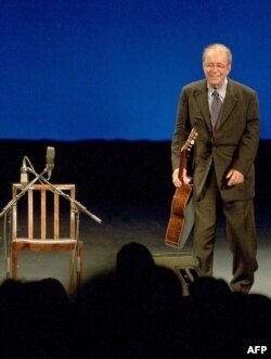 FILE - Joao Gilberto walks on stage at the Teatro Municipal in Rio de Janeiro, Aug. 24, 2008.