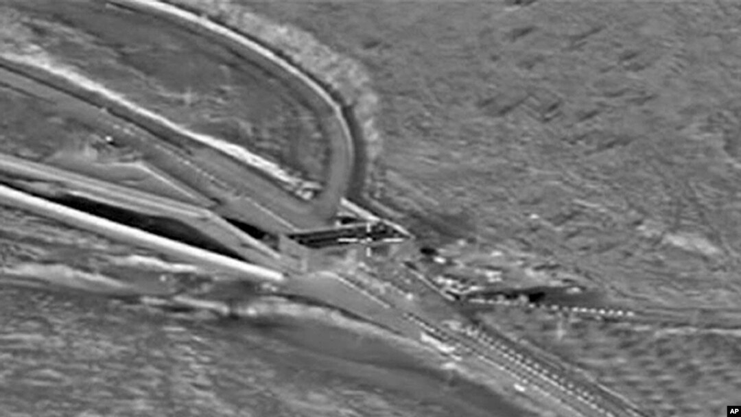 FILE - A Russian aerial image reportedly shows heavy trucks crossing the Syrian-Turkish border near Turkish check point Reyhanli. 