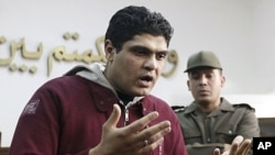 Army doctor Ahmed Adel, who was accused of carrying out a forced virginity test on a female detainee, speaks to the media after being acquitted in Cairo March 11, 2012.