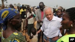U.S. Sen. Bob Corker, center, speaks to recent refugees from South Sudan at a registration center in Bidi Bidi, Uganda, April 14 2017. Corker, the Republican chairman of the Foreign Relations Committee, defended U.S. foreign assistance while visiting the world's fastest- growing refugee crisis in northern Uganda, just across the border from war-torn South Sudan.