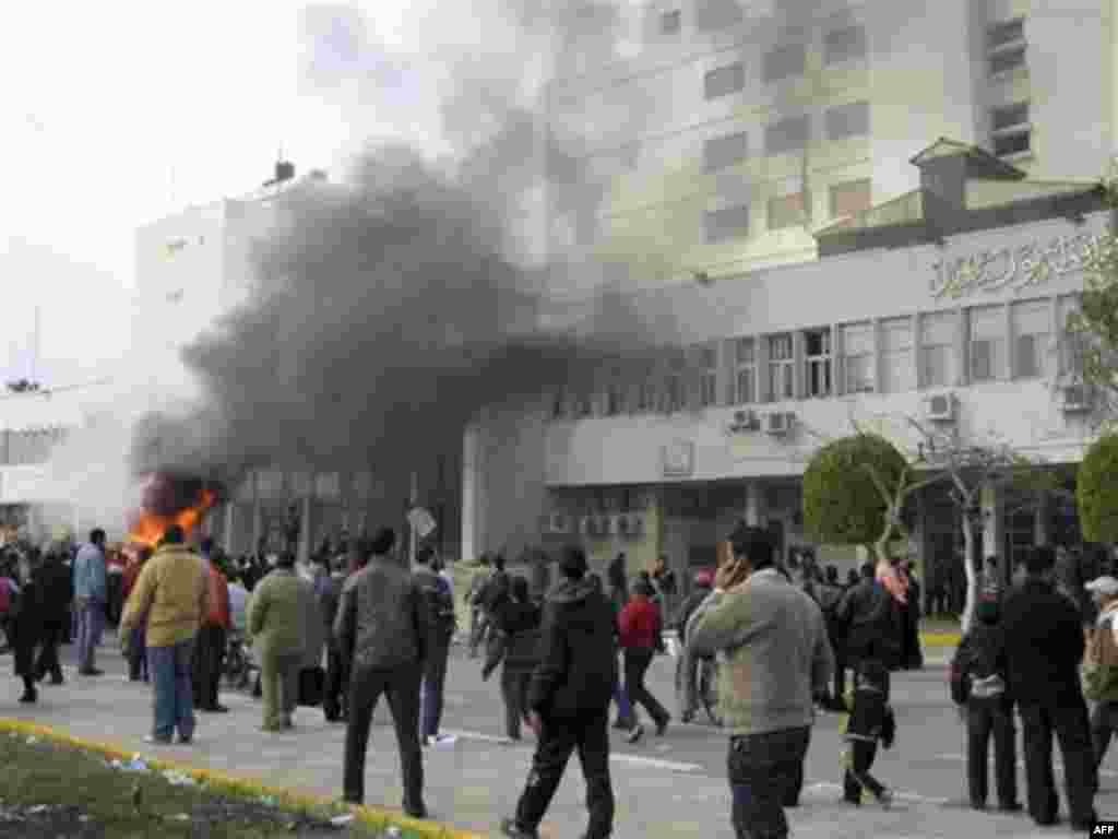 The local government headquarters, is set on fire by protesters, claiming delays on requests for housing in Port Said Thursday, Feb. 10, 2011. Labor unrest across the country gave powerful momentum to Egypt's wave of anti-government protests. With its e