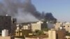 (FILE) Smoke rises amid clashes between armed factions in Libya.