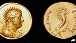 FILE: This undated photo shows a gold coin, depicting King Ptolemy III, who ruled Egypt in the 3rd century B.C. and was an ancestor of the famed Cleopatra, that was found in the San El-Hagar archaeological site in Gharbia province near Cairo, Egypt. Photo by Egypt Antiquities.