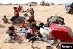 People displaced in fightings between the Syrian Democratic Forces and Islamic State militants are pictured at a refugee camp in Ain Issa, Syria, Oct. 14, 2017.