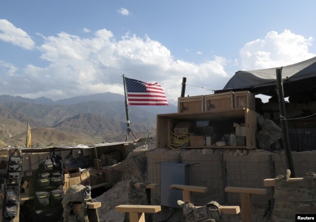 FILE - A U.S. flag is seen at a post in Deh Bala district, Nangarhar province, Afghanistan July 7, 2018.