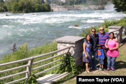 Vikas and Madhavi Vijay drove from Cleveland, Ohio, to Niagara Falls State Park to show their son and visiting parents “the pressure of the waterfalls” and experience the ‘Maid of the Mist’ boat ride. (R. Taylor/VOA)