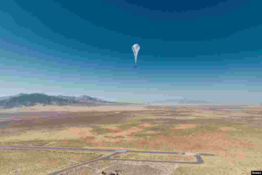 A Loon internet balloon, carrying solar-powered mobile networking equipment flies over the company's launch site in Winnemucca, Nevada. (Courtesy: Loon/Handout)
