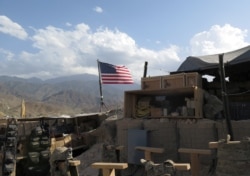 U.S. flag is seen at a post in Deh Bala district, Nangarhar province, Afghanistan July 7, 2018.