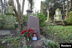 FILE - The grave of murdered ex-KGB agent Alexander (Sasha) Litvinenko is seen at Highgate Cemetery in London, Britain, Jan. 21, 2016. He was poisoned in 2006 with tea containing radioactive polonium-210.