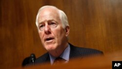 FILE - Sen. John Cornyn, R-Texas, speaks during a hearing about U.S. border security, May 8, 2019, on Capitol Hill.