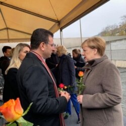 德国总理默克尔11月9日出席柏林墙倒塌30周年纪念活动。