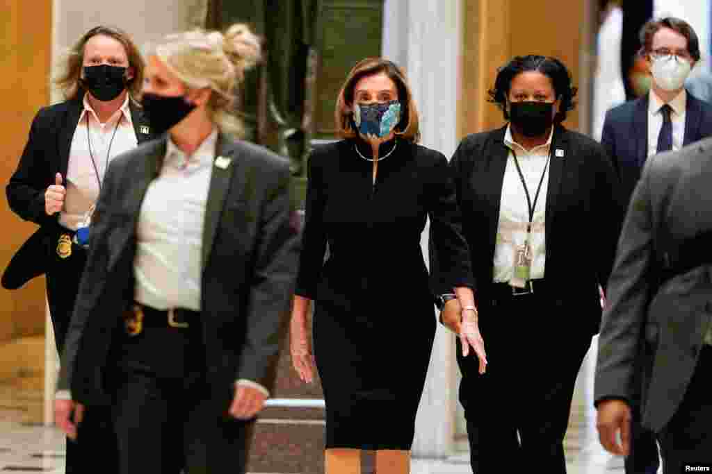 U.S. House Speaker Nancy Pelosi (D-CA) walks to the House Chamber as Democrats debate an article of impeachment against President Donald Trump at the Capitol, in Washington, D.C.