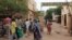 People walk in front of the 'Palace of Justice' courthouse in Bamako, August 28, 2012. 