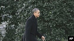 President Barack Obama walks back to the Oval Office of the White House in Washington, February 10, 2011