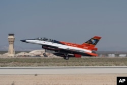 The X-62A VISTA aircraft, an experimental AI-enabled Air Force F-16 fighter jet, takes off on Thursday, May 2, 2024, at Edwards Air Force Base, Calif. (AP Photo/Damian Dovarganes)