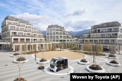 This photo provided by Woven by Toyota shows the square at the center of the apartment complexes of Woven City in Susono city, Shizuoka Prefecture, Feb. 2025.