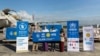 UNHCR နဲ့ WFP တို့ပူးပေါင်းပြီး မြန်မာနိုင်ငံအတွက် ကူညီတဲ့ ဗိုင်းရပ်စ်စစ်ဆေးတဲ့ ကိရိယာတွေကို လွဲှပြောင်းပေးအပ်တဲ့ မြင်ကွင်း။ (ဓာတ်ပုံ - United Nations Myanmar - ဇူလိုင် ၃၀၊ ၂၀၂၀)