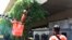 A team of migrant workers from India trim the trees along Holland Road in Singapore on Sunday, Apr. 19, 2020.