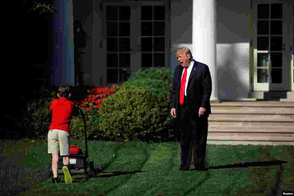 U.S. President Donald Trump welcomes 11-year-old Frank Giaccio as he cuts the Rose Garden grass at the White House in Washington, Sept. 15, 2017. Frank, who wrote a letter to Trump offering to mow the White House lawn, was invited to work for a day at the White House along the National Park Service staff.