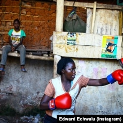 Edward Echwalu:A female boxer trains inside a makeshift gym in Katanga, Kampala, Uganda.